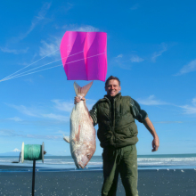 man holding caught fish